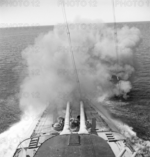 During World war II. The war ship Sverige during navy exercises at sea. The front cannons being fired and smoke is seen coming out of them. Sweden june 1940. Kristoffersson ref 141