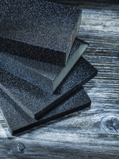 Polishing sanding blocks on vintage wooden board