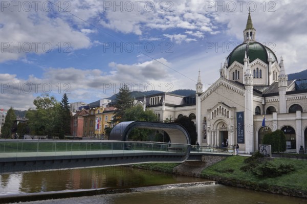 Festina Lente Bridge, pedestrian bridge over the Miljacka River, bridge with a loop, on the right the Academy of Fine Arts, Sarajevo, Bosnia and Herzegovina