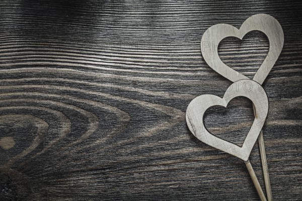 White wooden hearts on wood board holidays concept