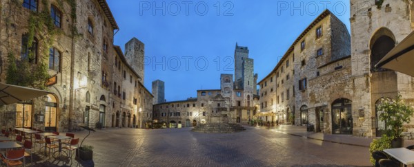 Panoramic view of famous Piazza della Cisterna in the historic town of San Gimignano on a morning, Tuscany, Italy
