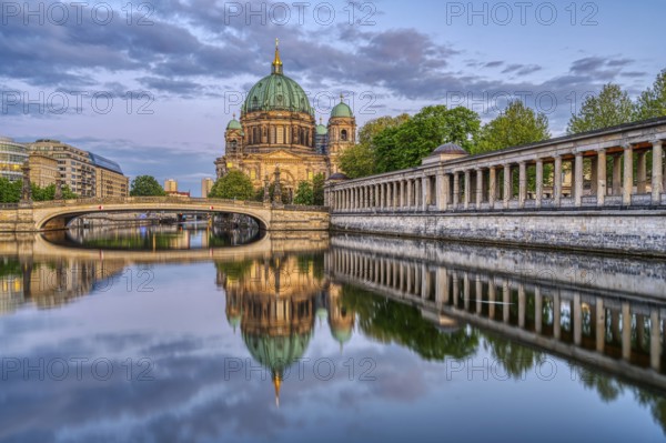 The Berlin Cathedral at dusk with a reflection in the River Spree