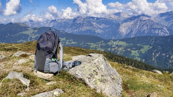 Hiking rucksack in front of a beautiful mountain backdrop