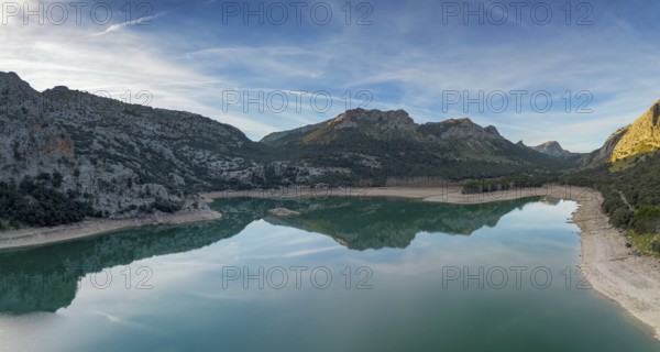 An aerial view of the picturesque Gorg Blau mountain lake and reservoir in the Serra de Tramuntana mountains of northern Mallorca
