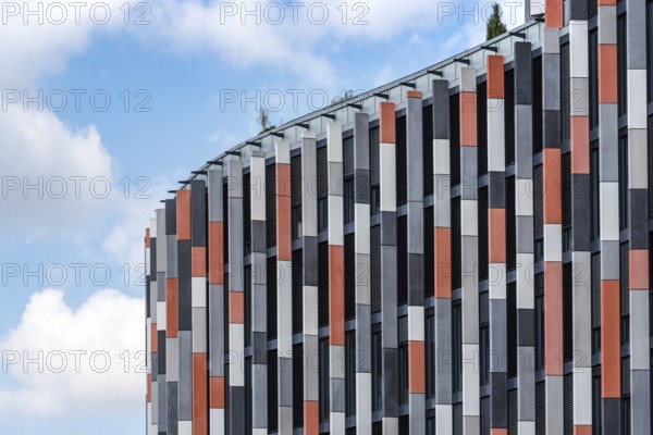 Low angle view of modern office building against sky