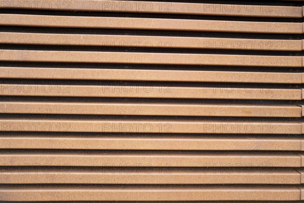 Rusted metal wall in the sun