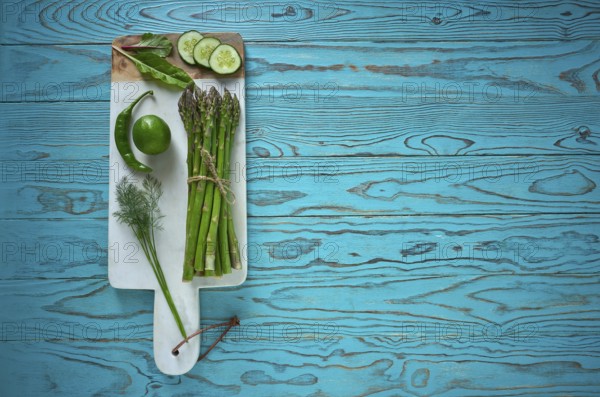 Healthy food vegetables for heart heath on wooden turquoise background