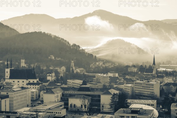 Morning atmosphere and morning fog over the Calvary, churches of Leoben, Leoben, Styria, Austria