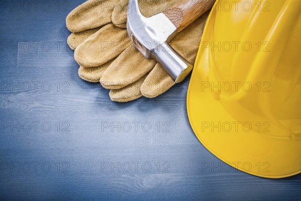 Composition of building helmet claw hammer protective gloves construction concept