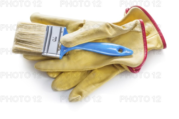 Blue paintbrush on yellow leather working gloves isolated