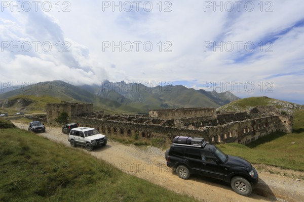 Off-road vehicle tour on the former military track on the French-Italian border Ligurian border ridge road, ruins of the former barracks at Col de Tende, Departement Alpes-Maritimes, France, Italy