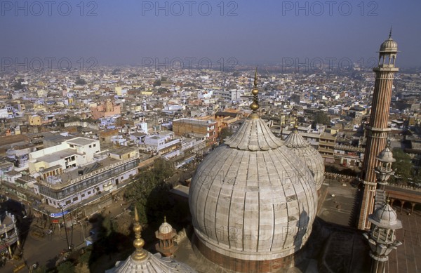Delhi's great Masjid-i Jahan-Numa, commonly known as the Jama Masjid or Friday Mosque is the largest in the country, with a courtyard capable of holding 25, 000 worshippers. It was built in 1644, the last in a series of magnificent architectural achievements by Shah Jahan, the Moghul emperor who also built the Taj Mahal and the Red Fort.<br/><br/> The elaborately decorated mosque has three great gateways, four towers and two 40m (131ft) high minarets constructed of alternating bands of red sandstone and white marble. Non-Muslims are welcome to visit the mosque but preferably not during prayer times, revealing clothing is not permitted within the precincts