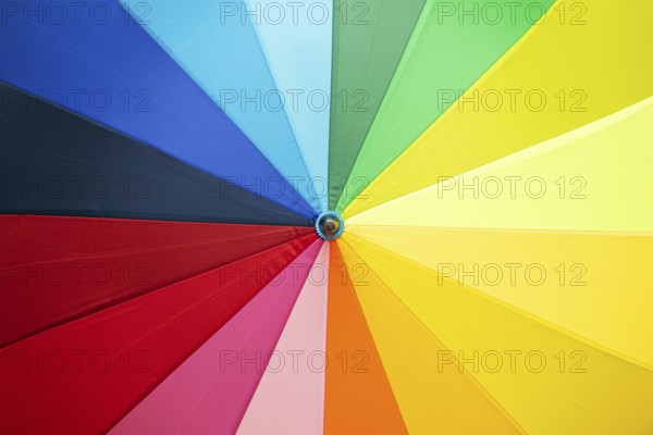 Open multicolored umbrella background