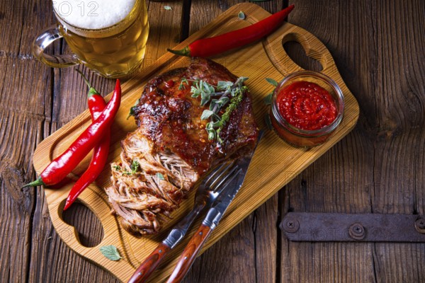 Pork with beer sauce pulled from the oven