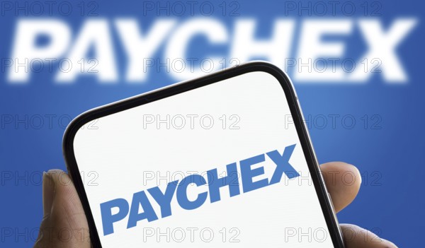 Paychex logo is displayed on smartphone