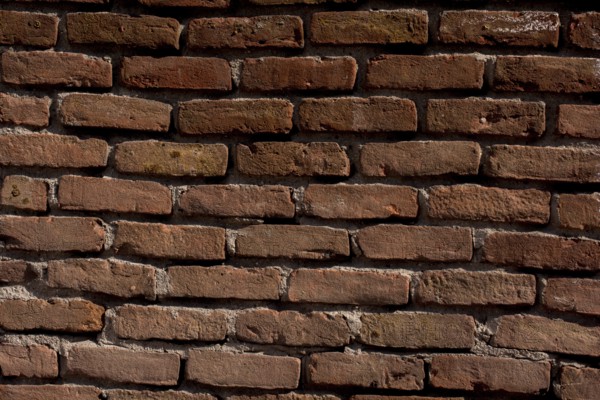 Old vintage grunge brick wall background texture with place for text