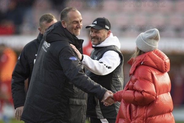 Football match, coach Frank SCHMIDT 1.FC Heidenheim left smiling and enthusiastically greeting coach Steffen BAUMGART 1.FC Union Berlin who is also smiling and Union companion in front of the match, Voith-Arena, Heidenheim, Germany