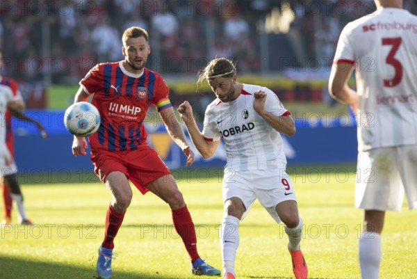 Football match, Lucas HÖLER SC Freiburg right, heads the ball and keeps an eye on it together with captain Patrick MAINKA 1.FC Heidenheim, Voith-Arena football stadium, Heidenheim