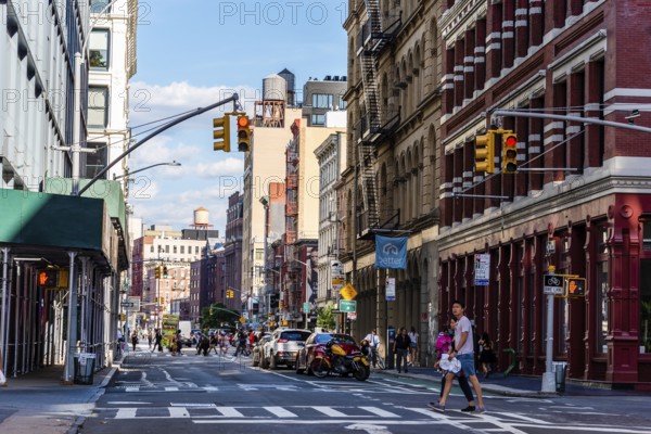 New York City, USA, June 25, 2018: Street with luxury fashion retail stores in Soho Cast Iron historic District in New York City