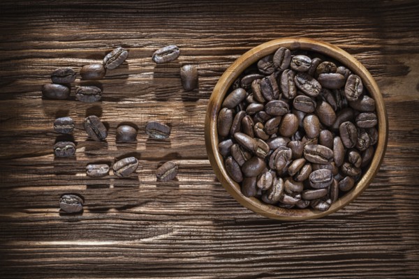 Coffee crops bowl on vintage wooden board