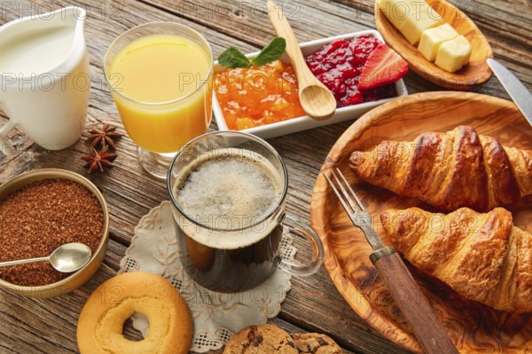 Breakfast continental with croissant coffe and orange juice