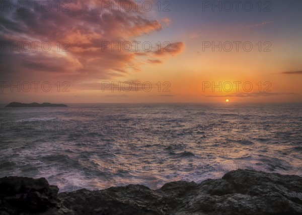 A dramatic sunset seascape at a northern California beach. USA