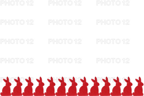 Red Easter bunnies in a row - isolated on white background Row of red easter bunnies - isolated on white background