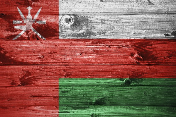 Oman flag on wooden planks background wood flag
