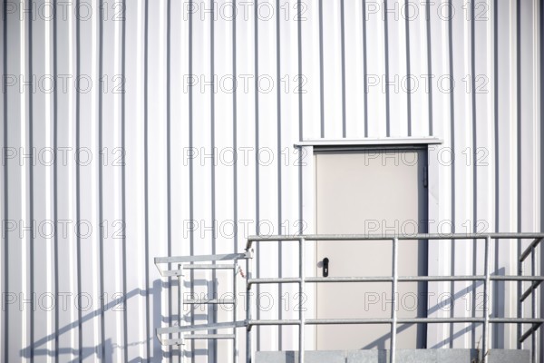 The side wall of a DIY store with an emergency exit