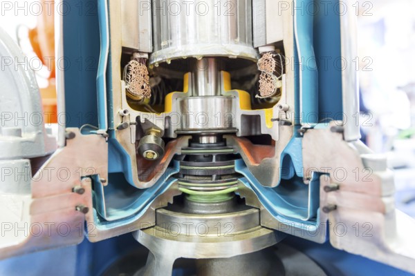 Inside view of a real model of a sliced water turbine. Rotor. A water turbine is a rotary machine that converts kinetic and potential energy of water into mechanical work