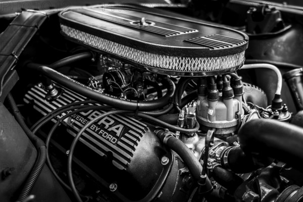 DIEDERSDORF, Germany - AUGUST 30, 2020: The engine of pony car Ford Mustang (first generation) . The exhibition of US Car Classics. Black and white