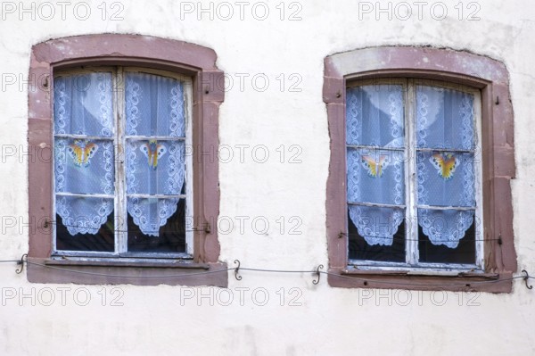 An image of two vintage windows in Thann France