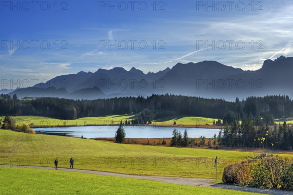 Autumnal Attlesee with Allgäu foothills and walks near Nesselwang, Allgäu, Bavaria, Germany