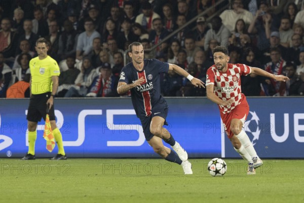 Football match, Miguel GUTIERREZ Girona FC right on the ball in a duel with Fabian RUIZ Paris St. Germain, Parc des Princes football stadium, Paris