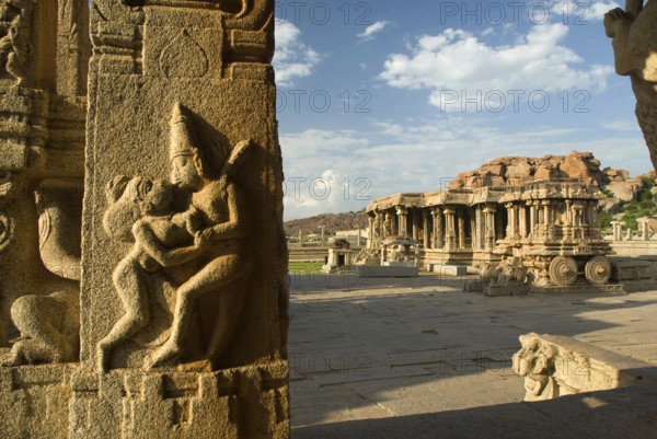 Erotic panel on pillar in Kalyana Mandapa and Stone Chariot in Vitthala temple, Hampi, Karnataka, India