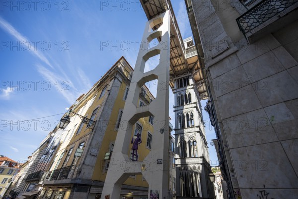 An urban area with historic buildings and an iconic lift under a blue sky in Lisbon, Elevador de Santa Justa in Lisbon, Portugal