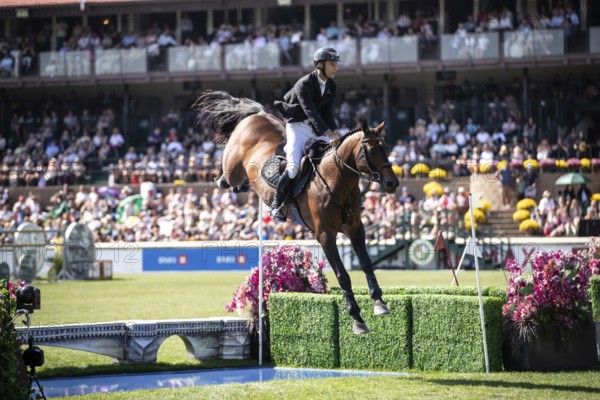 Richard Vogel of Germany and riding United Touch S compete in the first round of the 1.60m CPKC International during the Spruce Meadows Masters, presented by Rolex, in Calgary, Alberta, Canada, North America