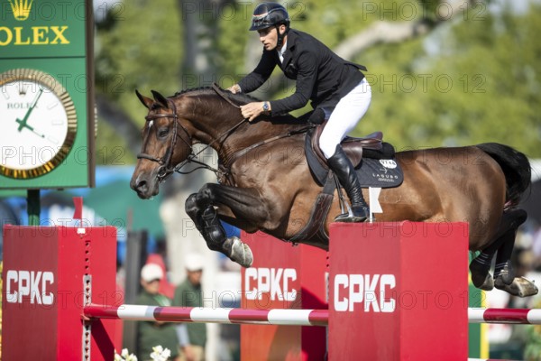 German rider Richard Vogel riding United Touch S competes in the second round and jumpoff of the CPKC International GP at Spruce Meadows Masters, in Calgary, Alberta, Canada, North America