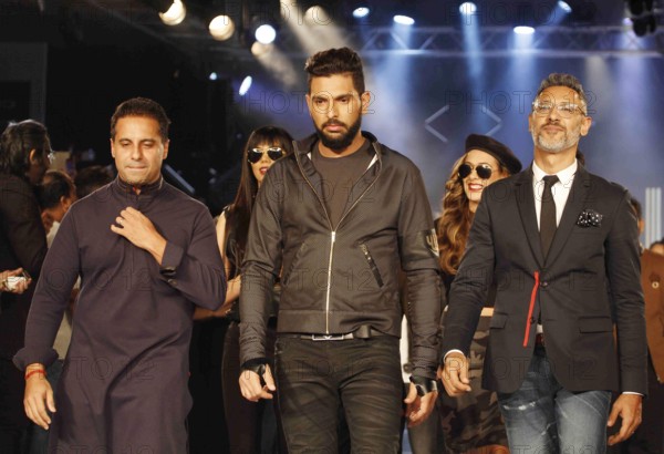 Indian cricket player Yuvraj Singh fashion designers Shantanu Nikhil walks ramp launch clothing brand YWC in Mumbai
