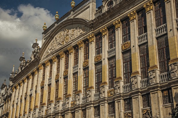Close-up of the rich and elegant decoration on the historic buildings at Grand Place of Brussels. Vibrant and friendly, is the capital of country and administrative center of the EU. Central Belgium