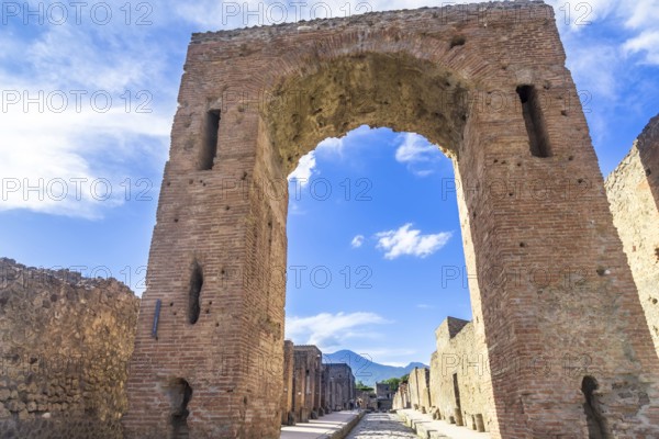 Pompeii in Italy, ruins of the antique Temple of Apollo with bronze Apollo statue, Naples