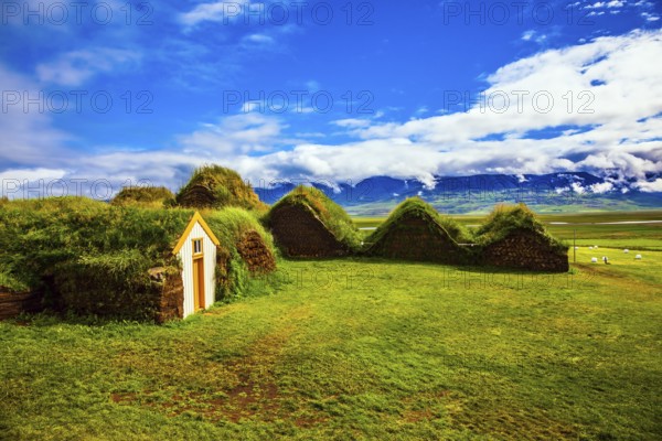 Ethnographic Museum-estate Glaumbaer, Iceland. The picturesque village of old houses covered with turf and grass. The concept of the cultural and historical tourism