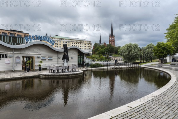 Sundsvall, Vastnorrland County, 08 02 2019: Panoramic view over the water, the bridge and the church tower of old town