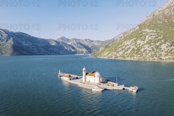Church of Our Lady of the Rocks on the island of Gospa od Skrpjela. Bay of Kotor, Montenegro. Drone.