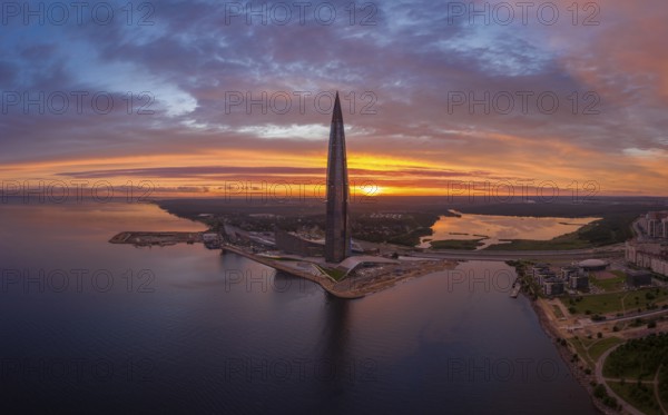 SAINT-PETERSBURG, RUSSIA, JUNE 20, 2019: Lakhta Center Tower Silhouette at Sunset. Aerial View. Russia. Colourful Sky and the Sun