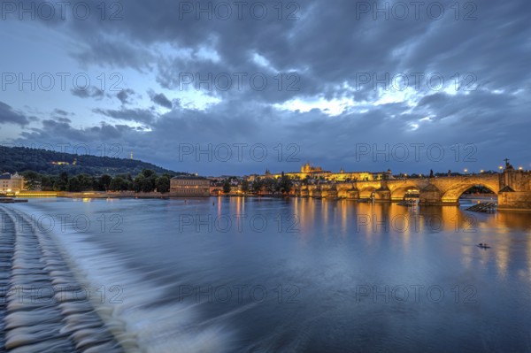 The famous Charles Bridge and Hradcany Castle in Prague at dusk
