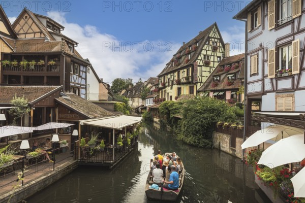 Little Venice (La Petite Venise), tourists enjoying a boat trip on the canal, Colmar, Alsace, Grand Est, France