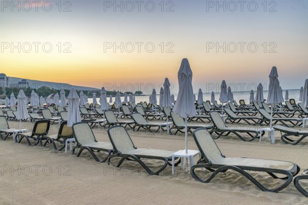 Chairs and umbrellas on a beautiful beach at sunrise in Sunny Beach on the Black Sea coast of Bulgaria