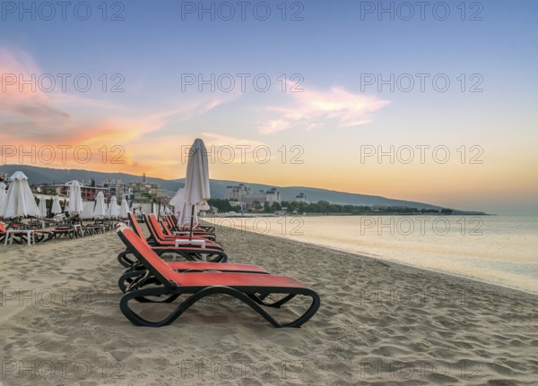 Chairs and umbrellas on a beautiful beach at sunrise in Sunny Beach on the Black Sea coast of Bulgaria