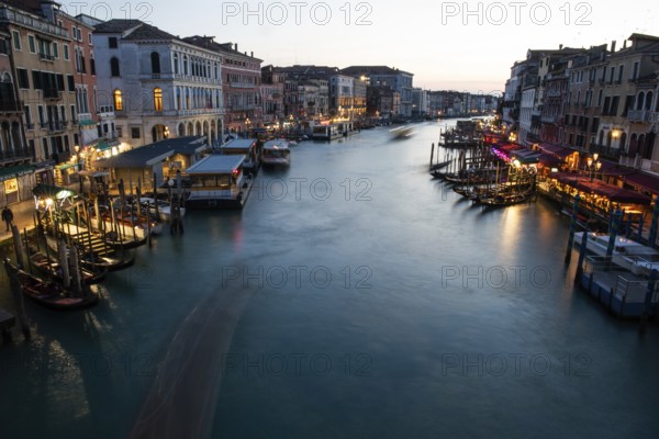 Evening atmosphere, view from the Rialto Bridge onto the Grand Canal, long exposure, Venice, Italy